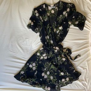 Reformation floral black short/ mini wrap dress.